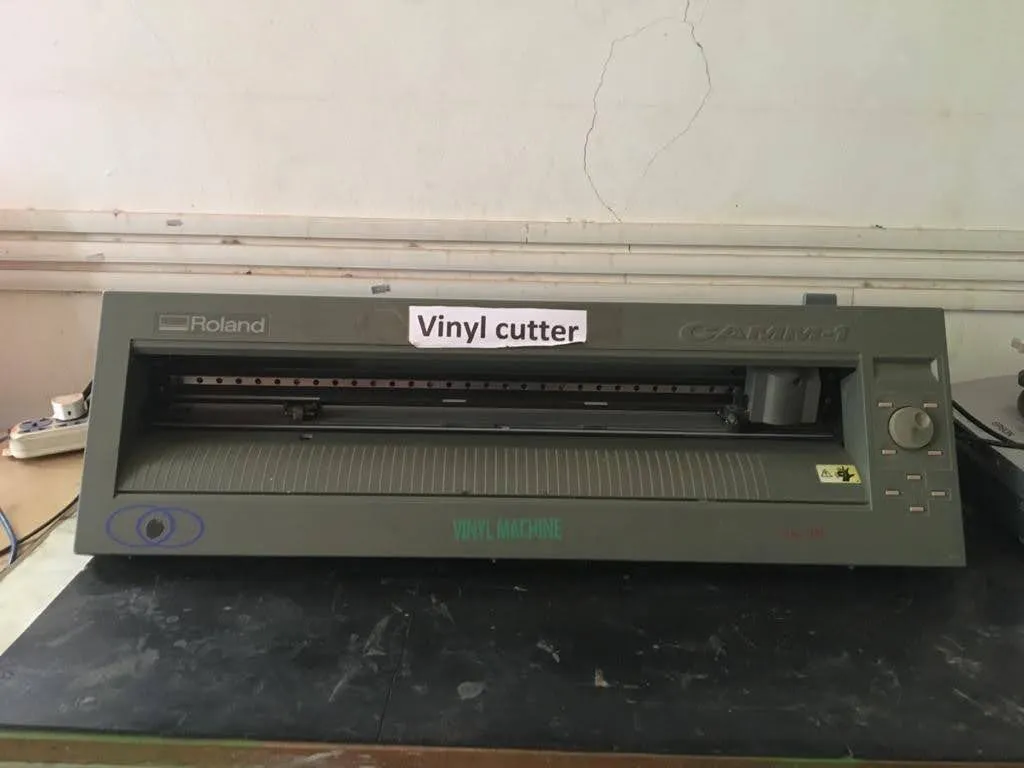 Vinyl cutting machine with adhesive vinyl roll loaded