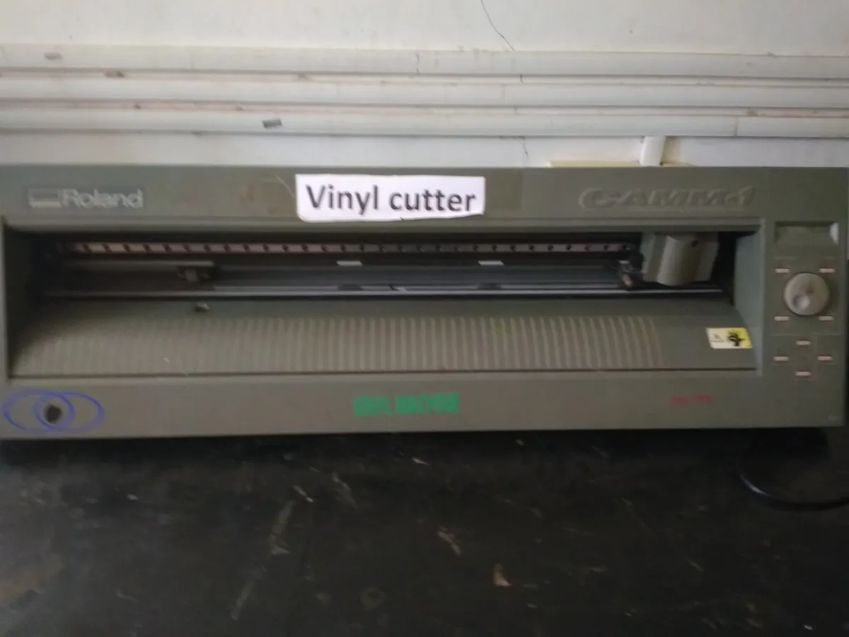 Close-up of a craft cutting machine with cutting blade carriage
