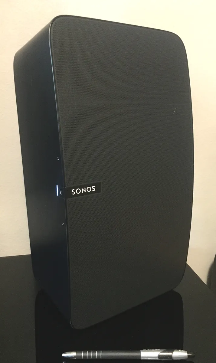 Sonos wireless speaker shown next to a pencil for size comparison