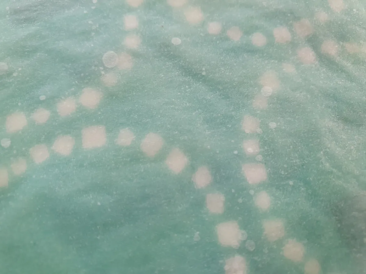 Beeswax food wrap being prepared as a plastic-free kitchen alternative
