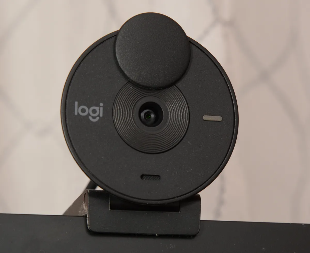 Logitech Brio webcam viewed from the side showing its compact cylindrical body