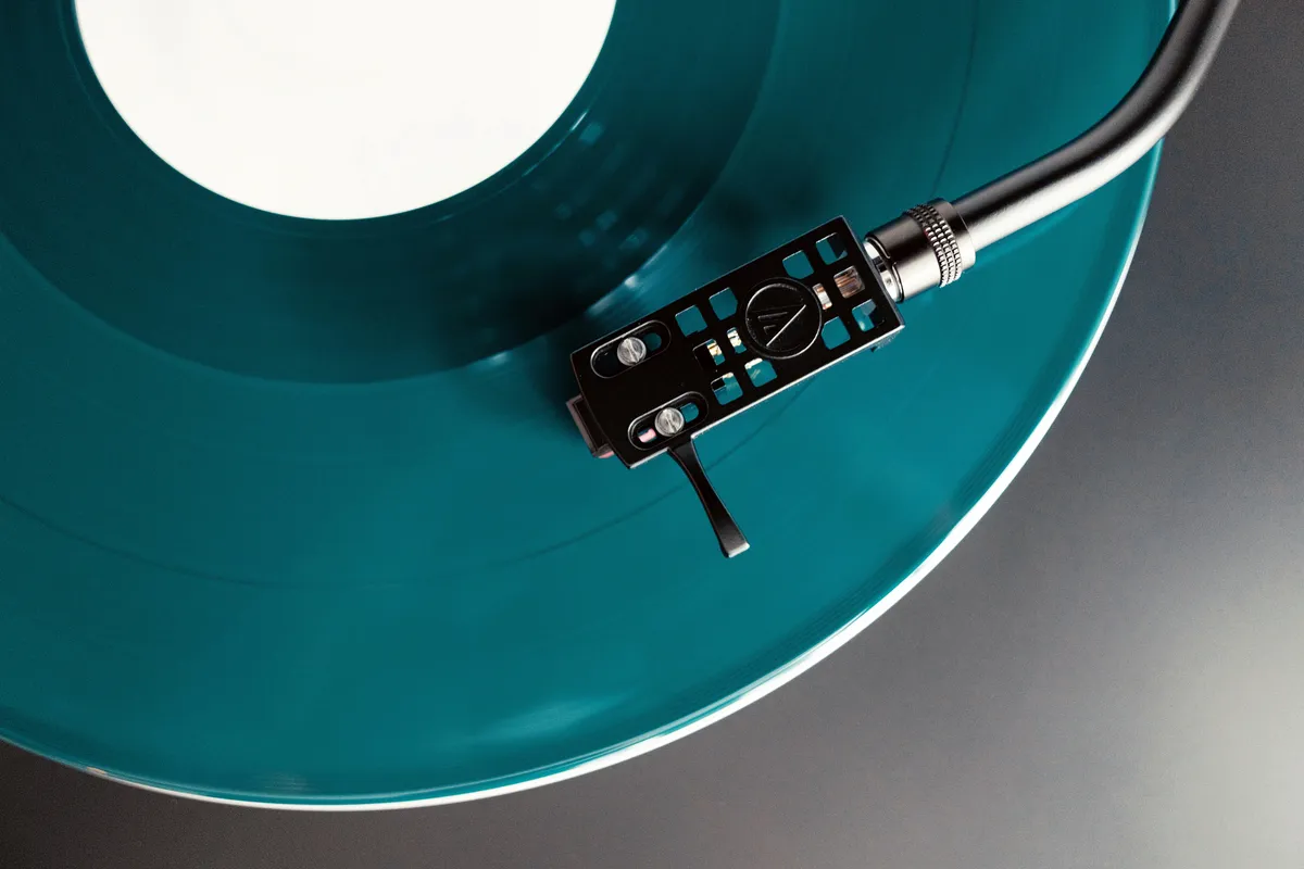 Audio-Technica turntable playing a coloured vinyl record