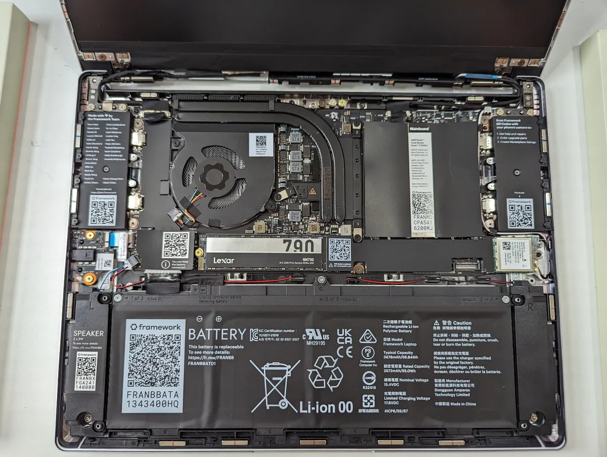 Internal component and motherboard view of a Framework Laptop 13, showing the modular mainboard layout