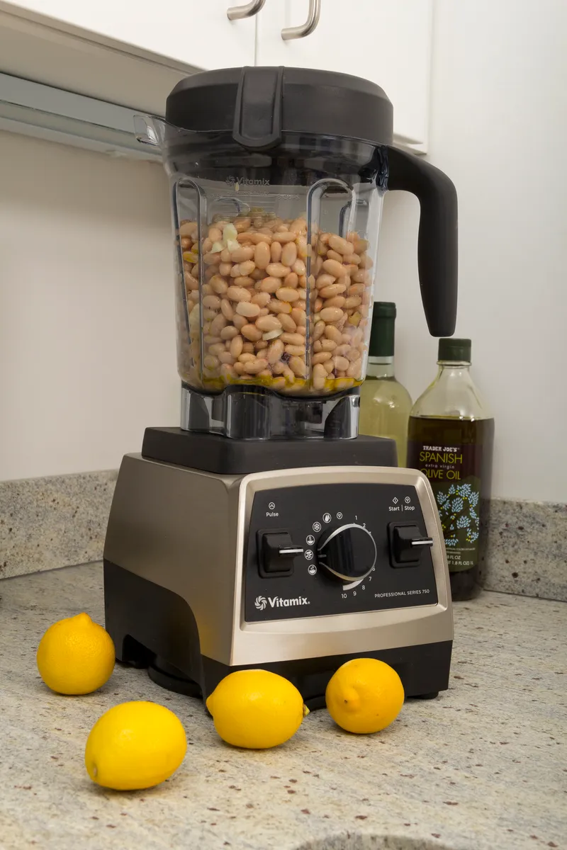 Vitamix blender on a kitchen counter next to other kitchen appliances