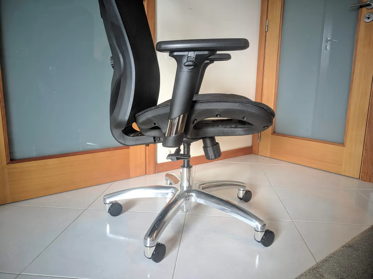 Close-up of the lower back and lumbar mesh area of an ergonomic office chair