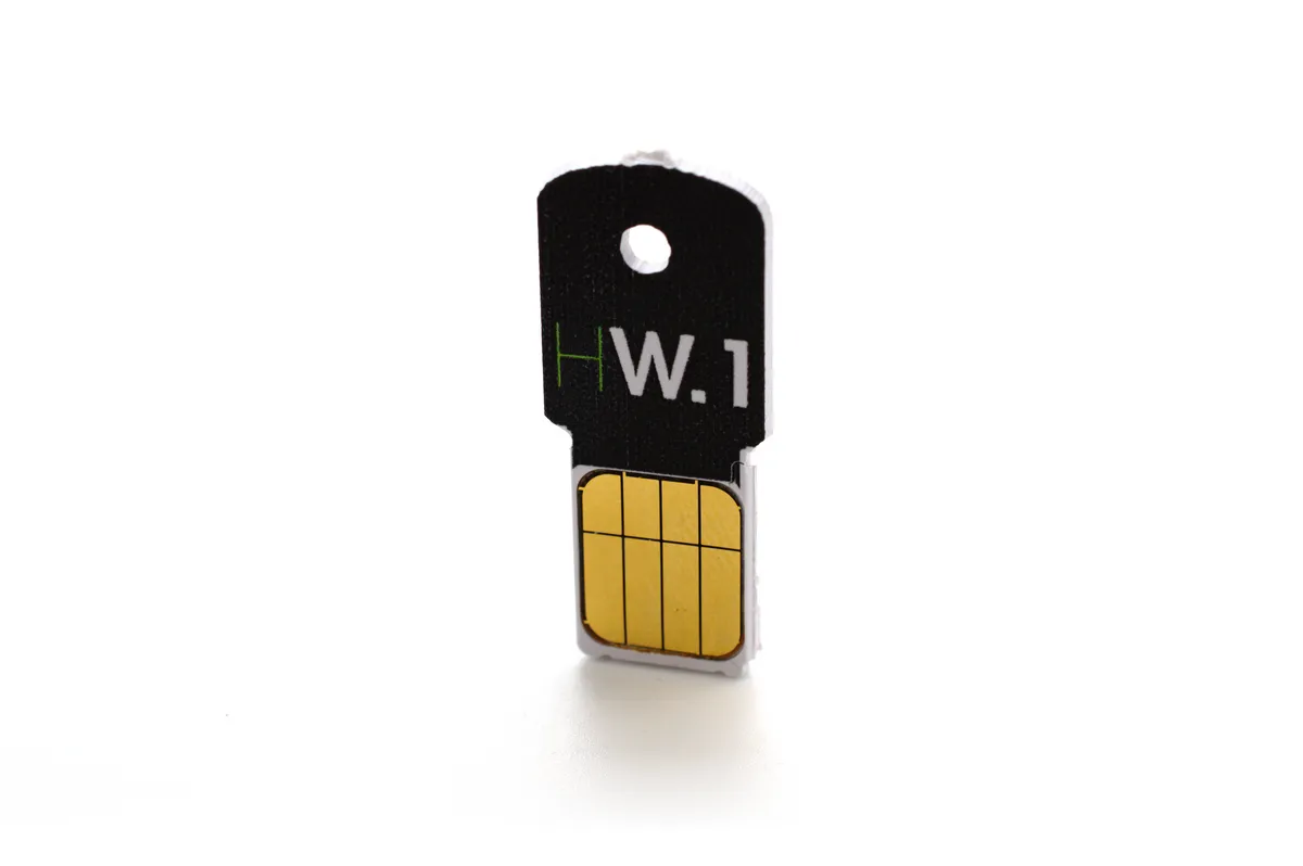 Older Ledger HW.1 Bitcoin hardware wallet dongle and accessories, an earlier device in Ledger's hardware wallet lineage