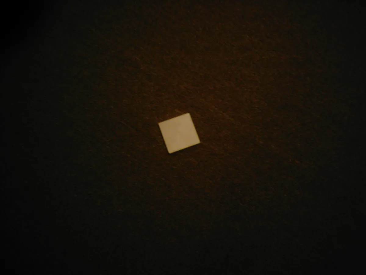 A single white square Magna-Tile magnetic building tile shown against a plain background