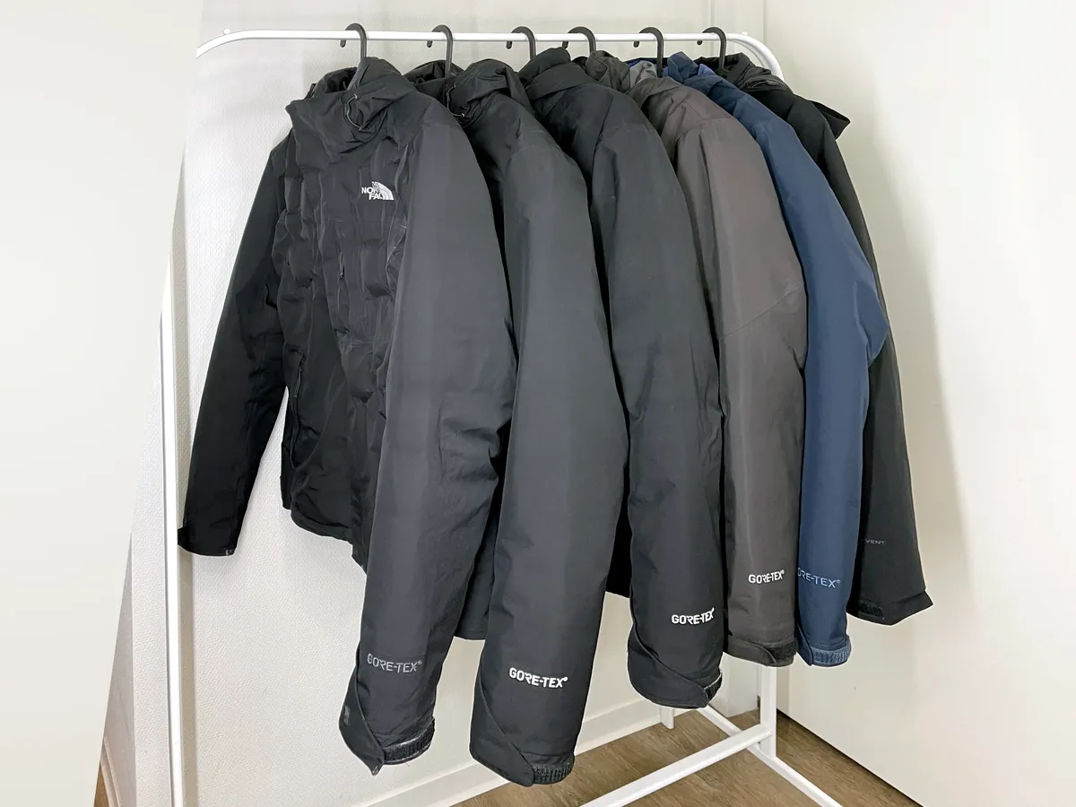 Insulated technical jacket on a hanger, illustrating the general category of synthetic and down mid-layer jackets