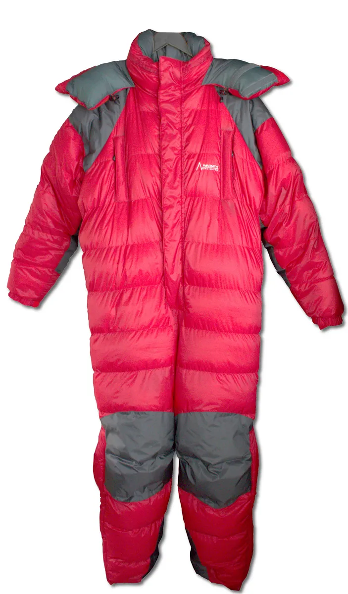 Person wearing a bulky insulated jacket outdoors in cold weather, illustrating real-world use of insulated outerwear