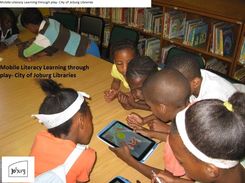 Children using tablets to play games and read stories at a library