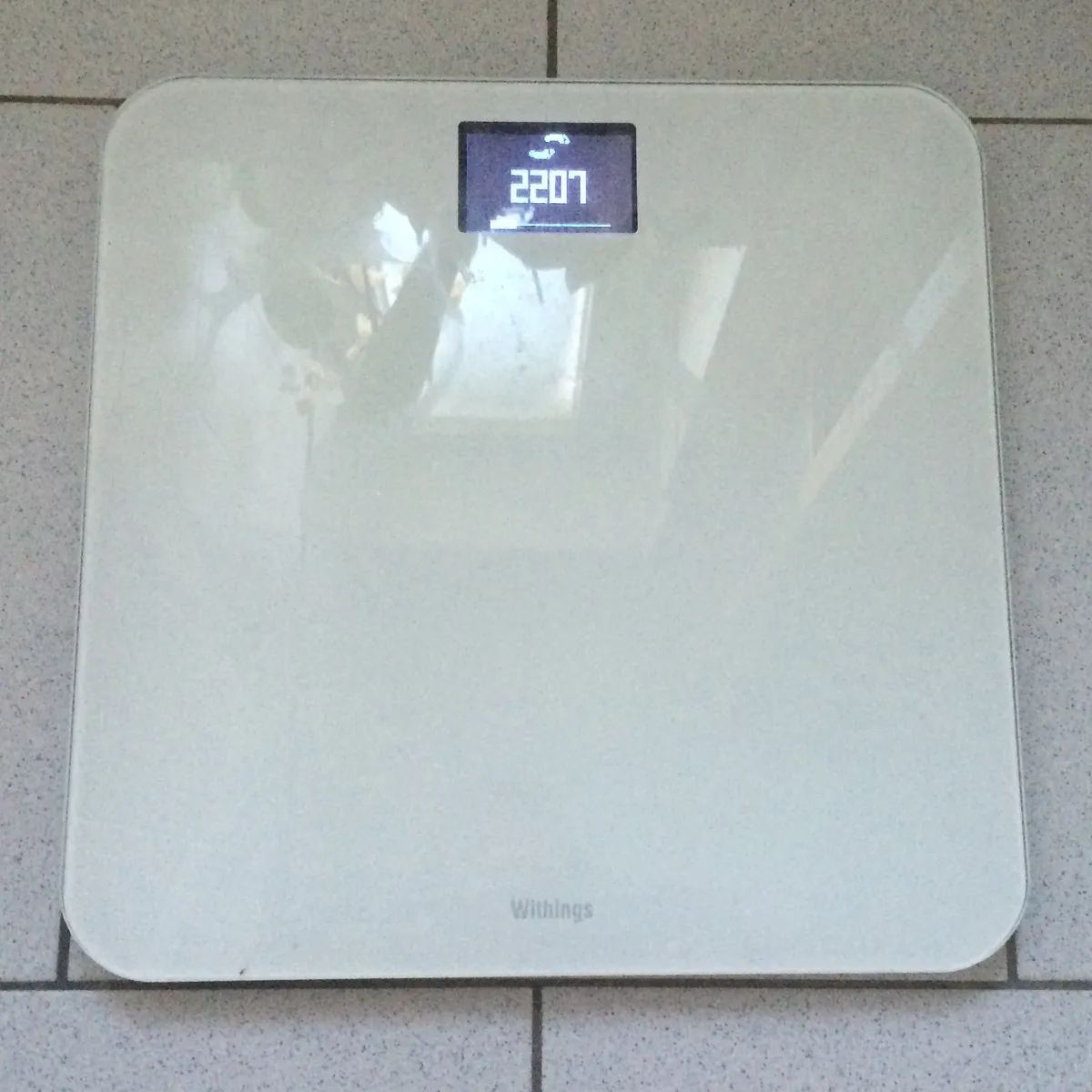 Withings Wi-Fi smart scale shown from above with metal sensor pads visible