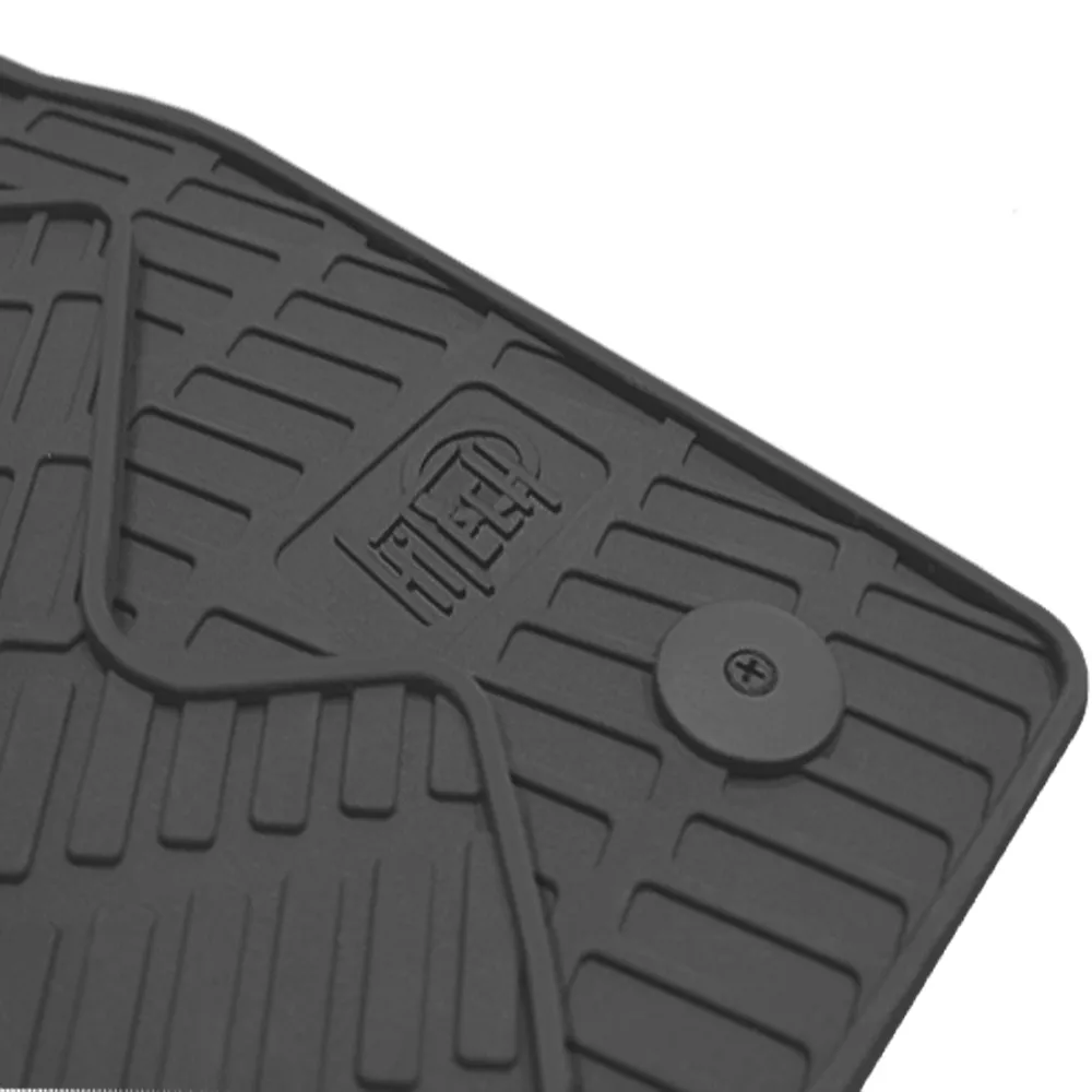 Set of moulded, custom-shaped rubber car mats designed for exact-fit installation in a specific vehicle model