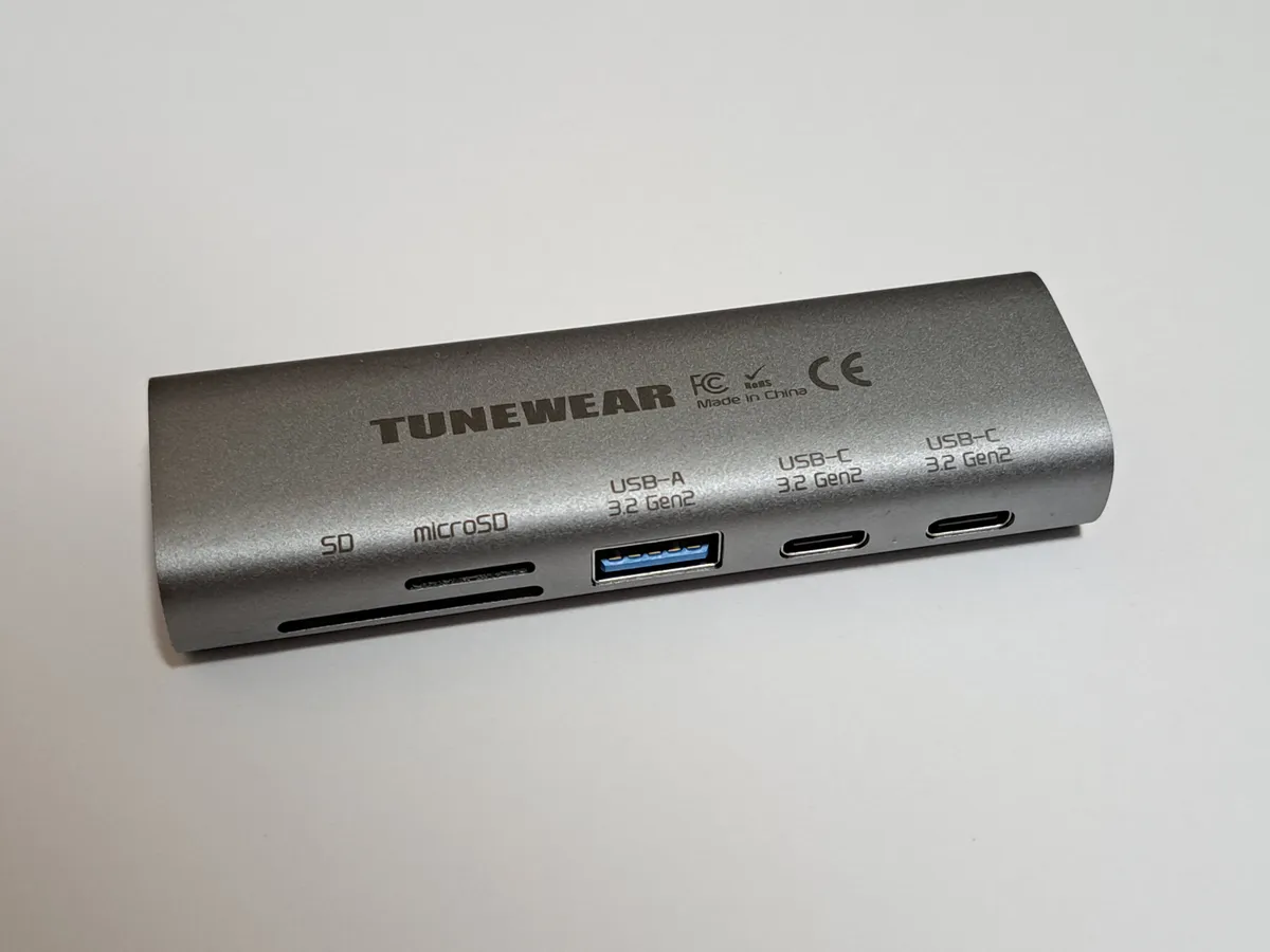 A compact USB-C docking station accessory shown on a desk