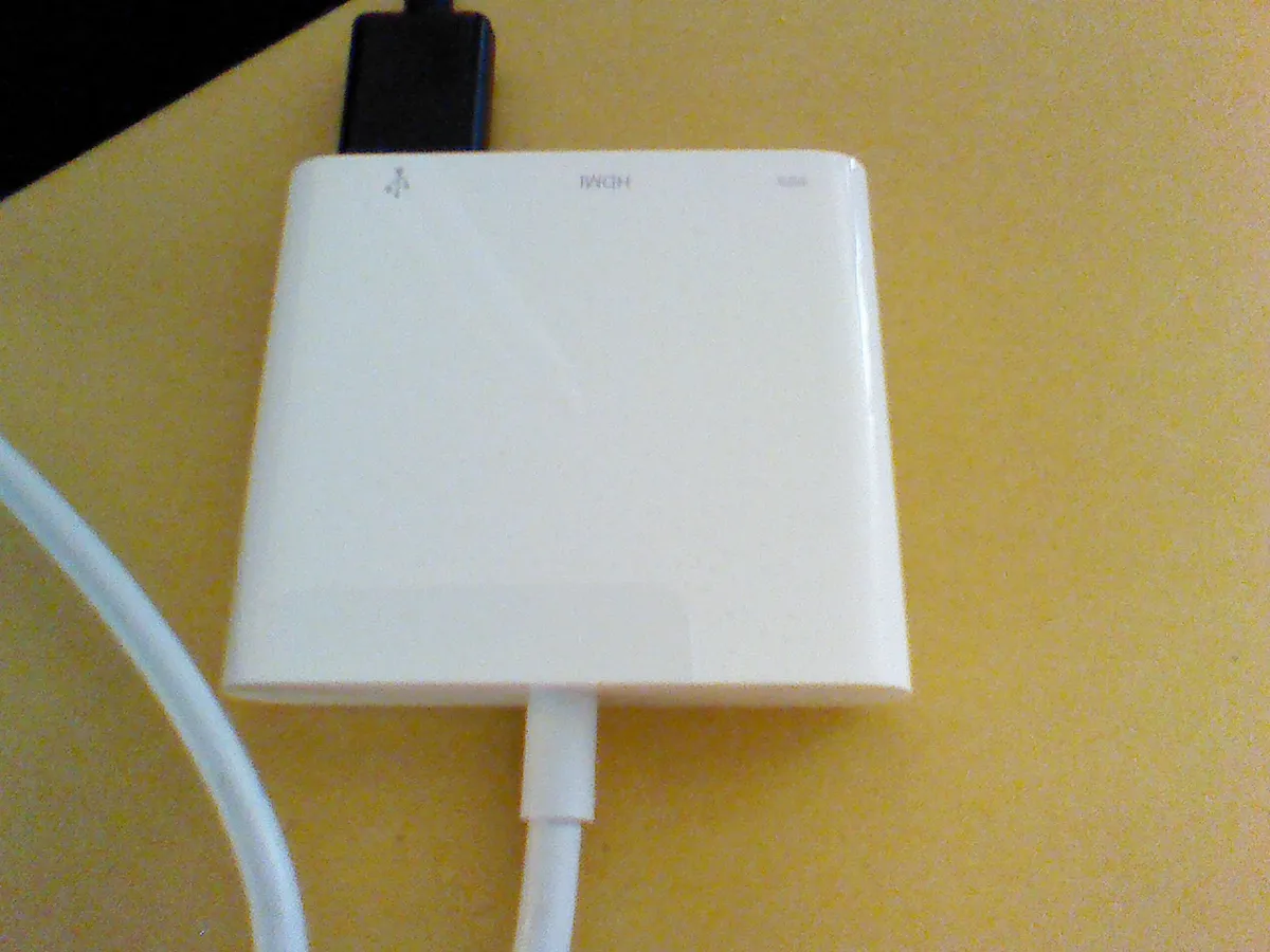 A USB-C multiport adapter with HDMI and USB ports, similar in concept to a multiport hub