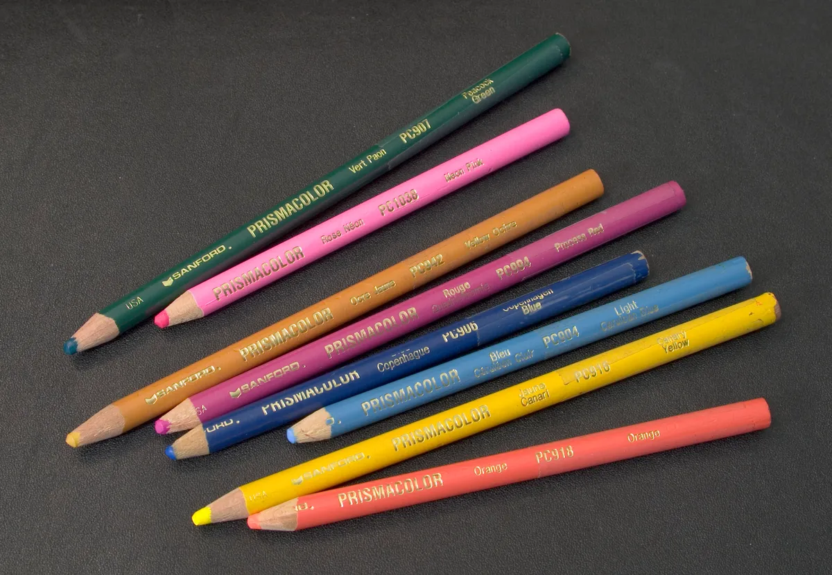 A collection of Prismacolor pencils arranged to show their color range, used for illustrating wax-based colored pencil blending
