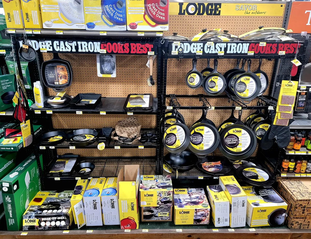 Retail display of Lodge cast iron cookware in various sizes