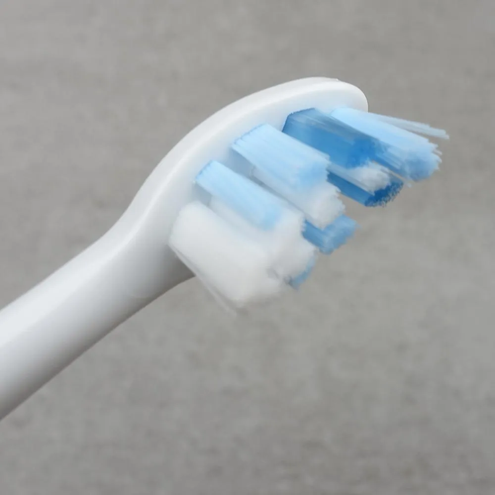 Philips Sonicare electric toothbrush standing on its inductive charging base