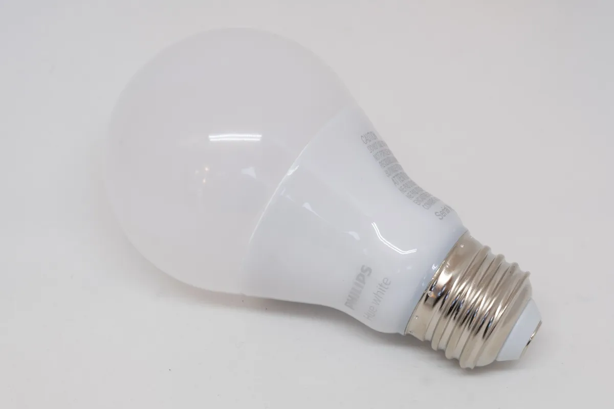 Philips Hue smart bulb held in hand showing the bulb form factor