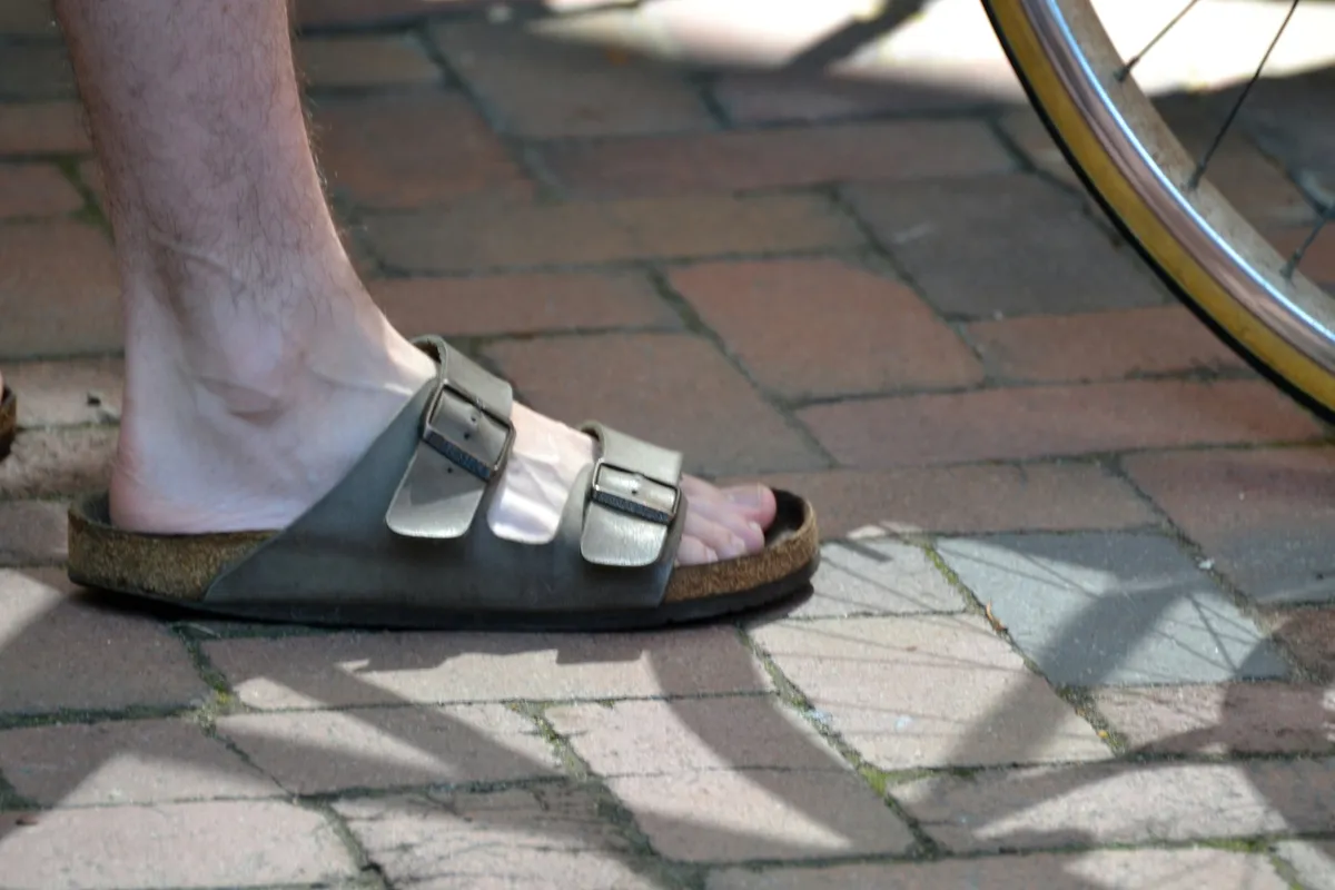 Worn Birkenstock sandals showing footbed impression from use