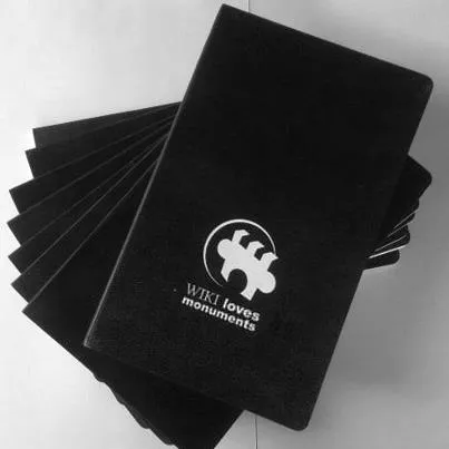 Several Moleskine notebooks stacked together