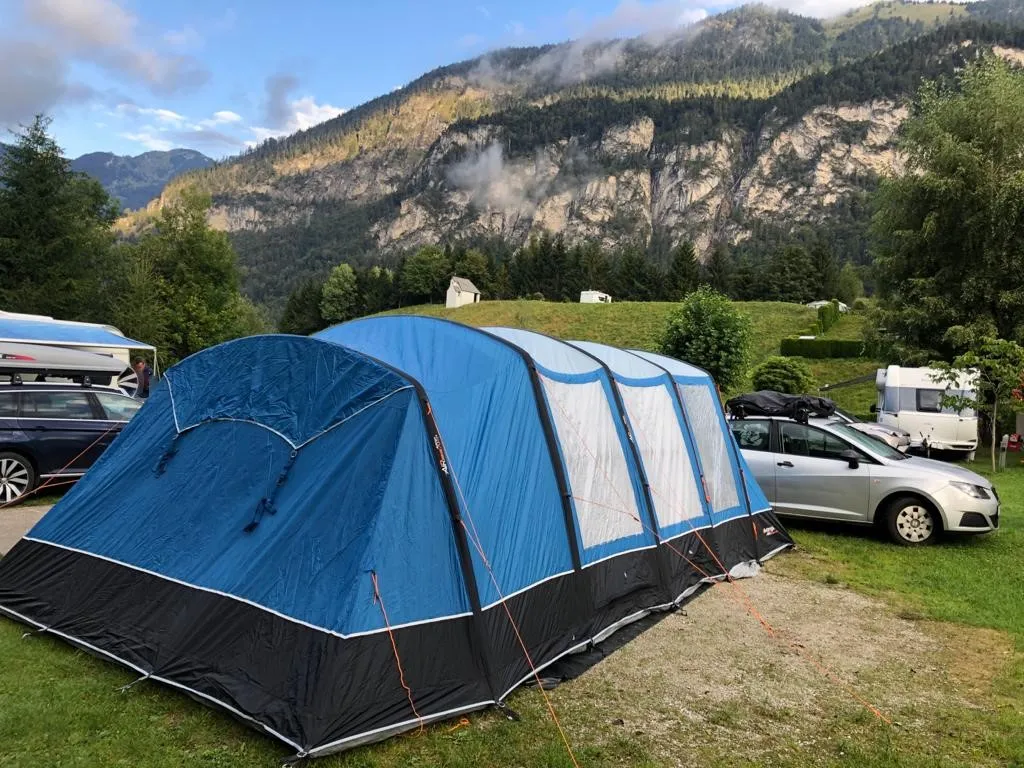 A dome tent pitched on a maintained campsite pitch