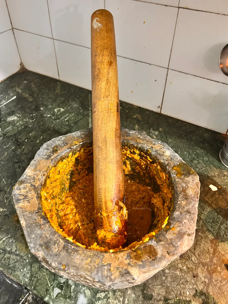 A traditional Indian kundi sota mortar and pestle used for cold-pressing spices and herbs