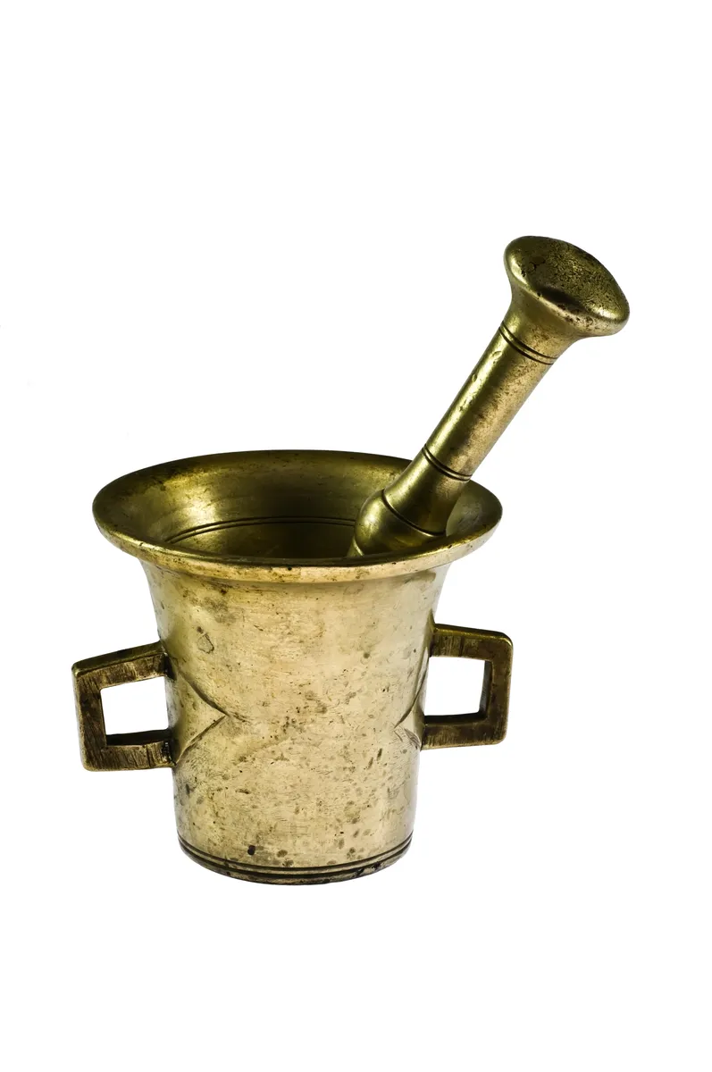A brass mortar and pestle, the metal alternative to stone