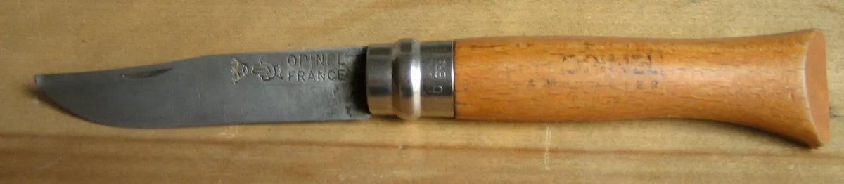 Opinel carbon steel blade showing a developed grey patina