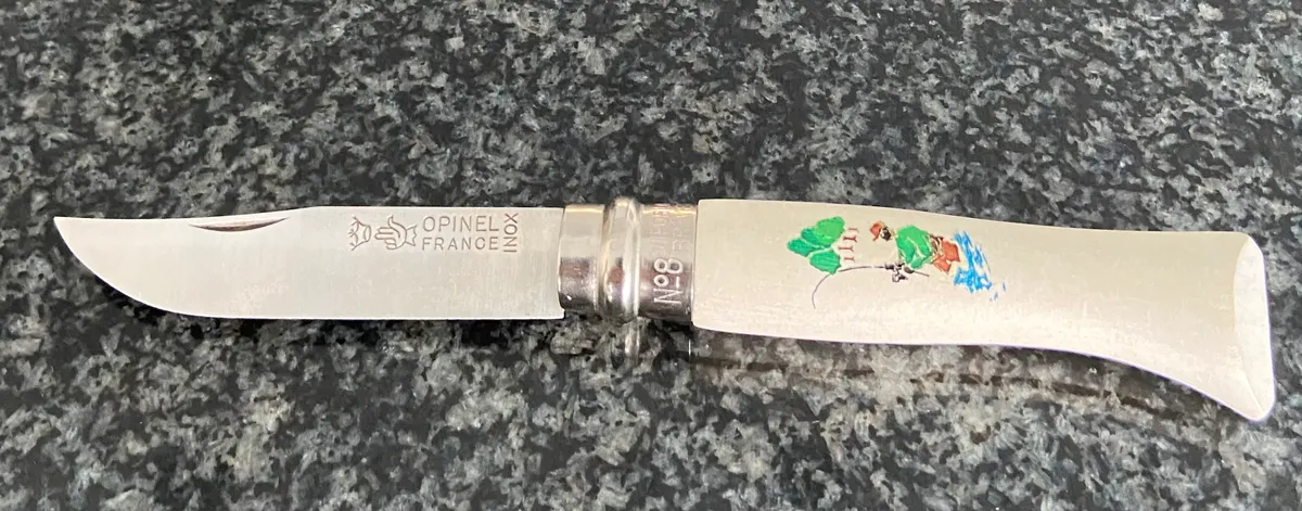Opinel No.8 knife open, showing blade profile and handle shape