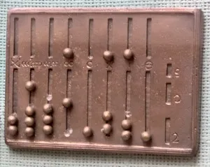 A reconstruction of a Roman abacus, an early counting frame