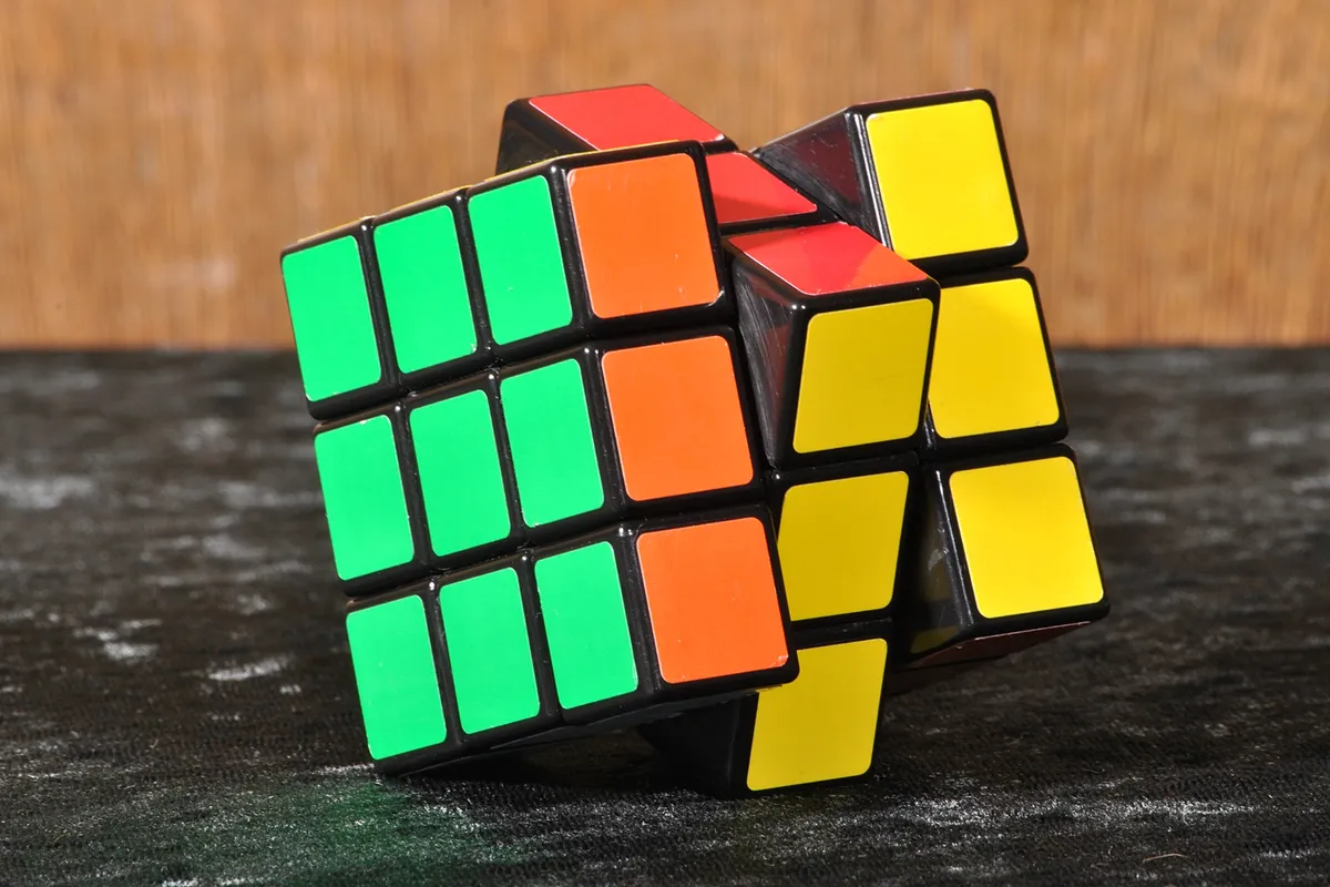 Close view of a Rubik's Cube showing the coloured faces and edges