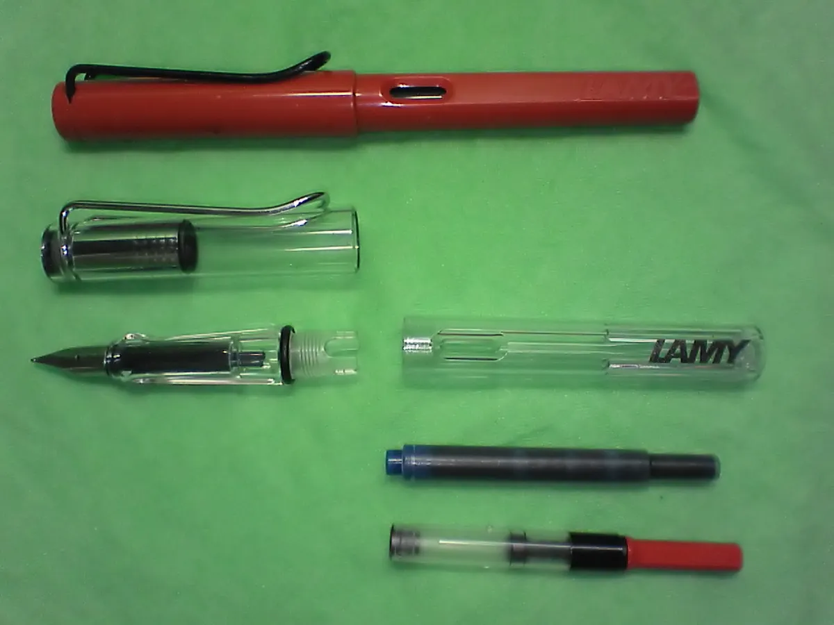 Lamy Safari and Vista pens shown disassembled with a cartridge and converter