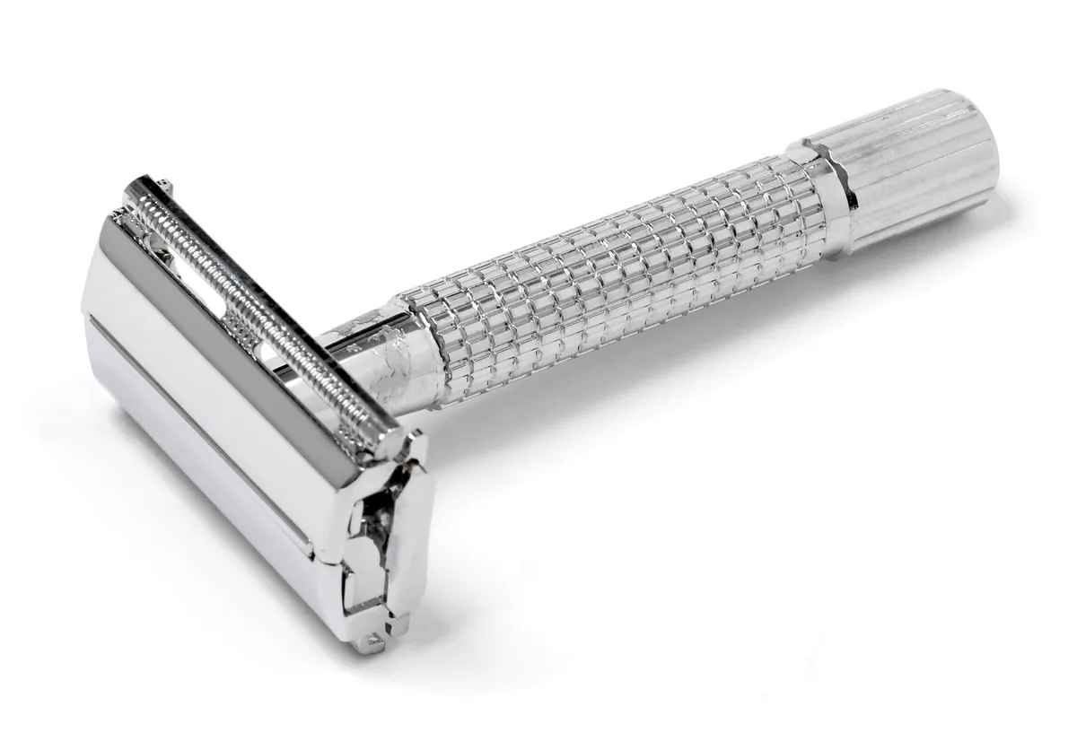 Chrome double-edge safety razor head showing the blade gap
