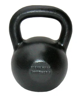 Cast iron kettlebell standing on a floor