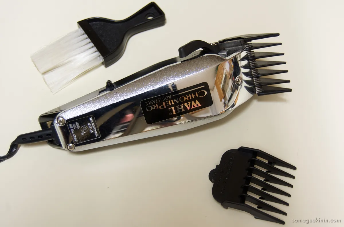 Hair clipper with a set of plastic guide combs
