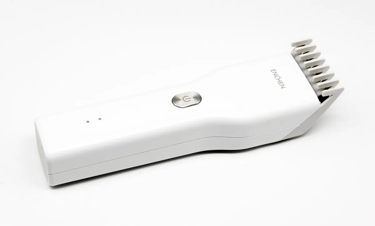 A compact cordless hair clipper, shown for comparison with corded models