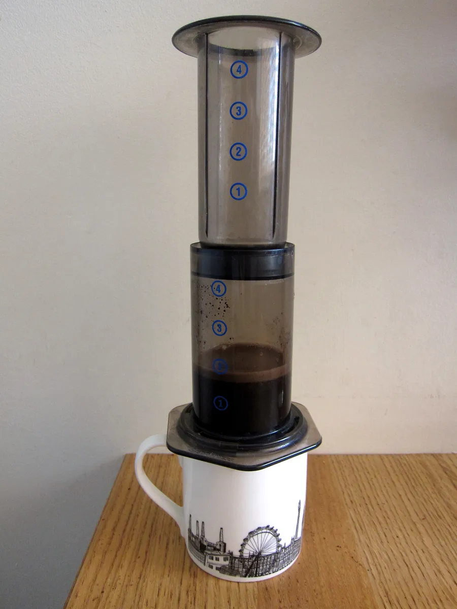AeroPress mid-brew with coffee and water in the chamber