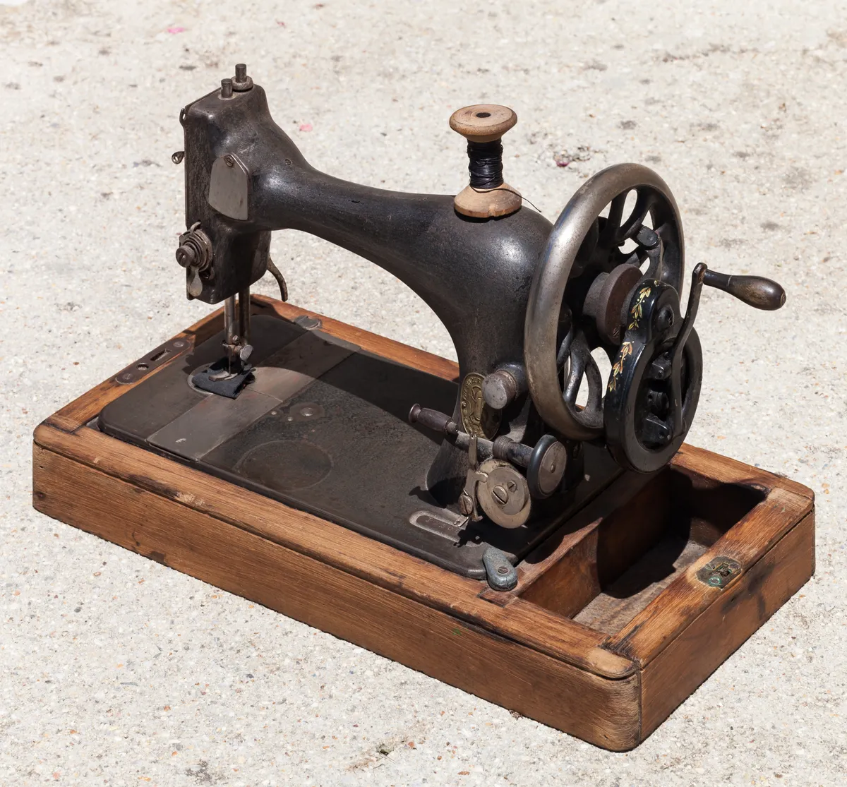 Detail of a Singer sewing machine showing the needle plate and feed area