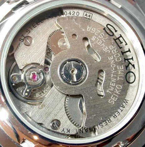 A Seiko automatic movement with rotor and bridges visible through the case back