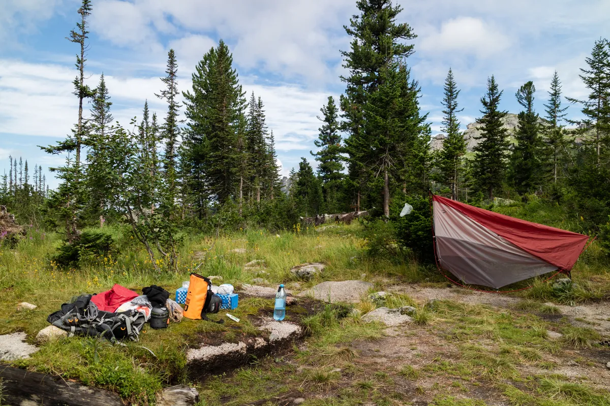 Camping equipment laid out at a campsite