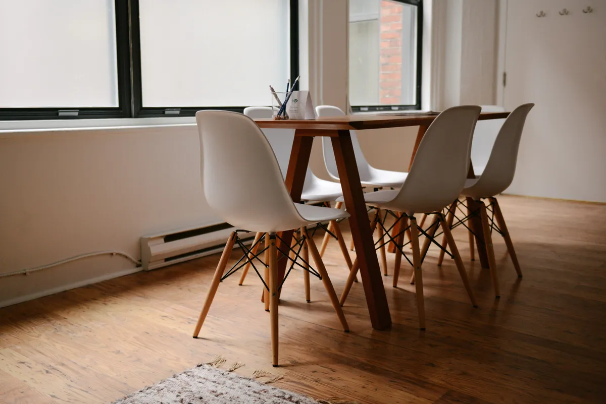 A row of chairs arranged in a meeting room