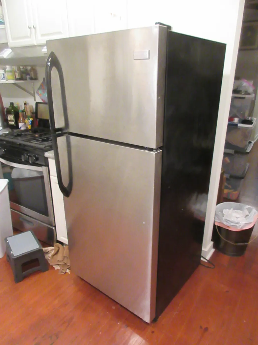A side-by-side domestic refrigerator and freezer