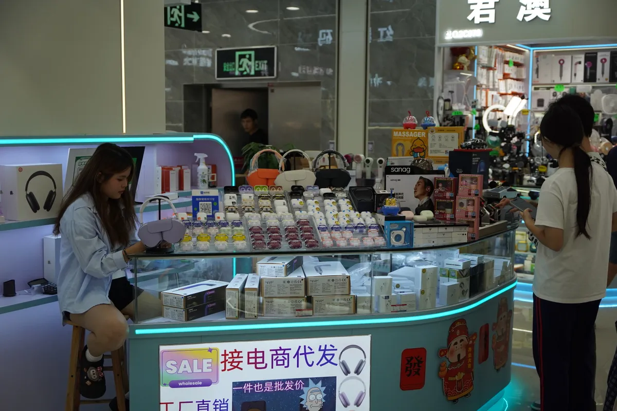 A market vendor stall displaying rows of true wireless earbuds, illustrating the crowded budget and mid-range earbud market the Liberty 4 NC competes in